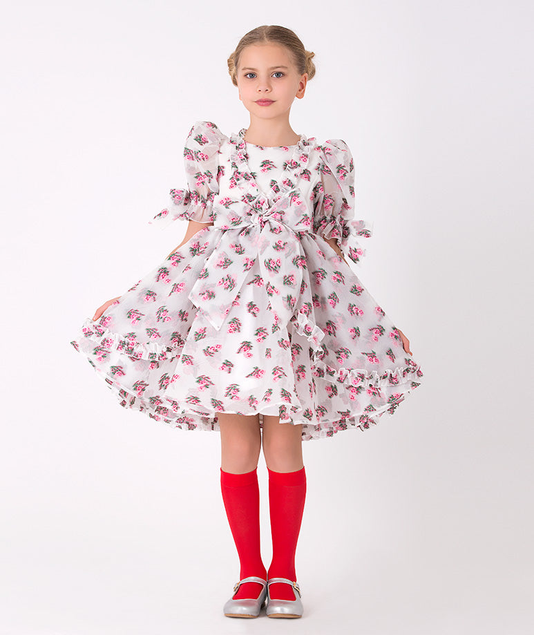 Girls' floral ruffle dress with puff sleeves – A charming design with a bow accent, ideal for special occasions.