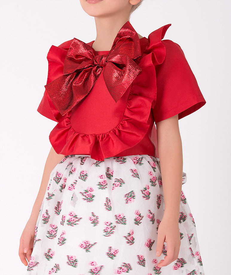 Festive girls' red and white floral outfit – Eye-catching red top with a large bow and a white floral skirt, perfect for special occasions