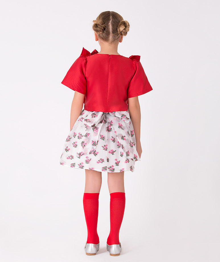 Elegant girls' red ruffle top and floral skirt ensemble – Unique design with a bold bow detail, ideal for holiday or party wear