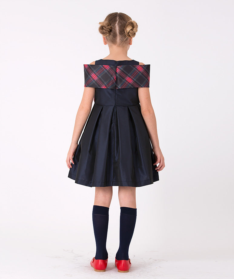 Girls' sleeveless navy dress with statement bow in plaid– A stylish sleeveless plaid dress adorned with a bold navy bow, designed for special events and holiday celebrations