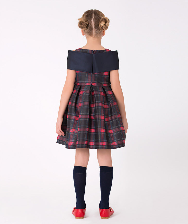 Girls' sleeveless plaid dress with statement bow in navy – A stylish sleeveless plaid dress adorned with a bold navy bow, designed for special events and holiday celebrations