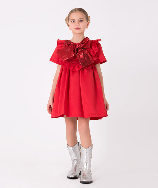 Girls' red dress with metallic bow and ruffle accents – A stylish red dress featuring a shimmering oversized bow and playful ruffles, perfect for festive occasions