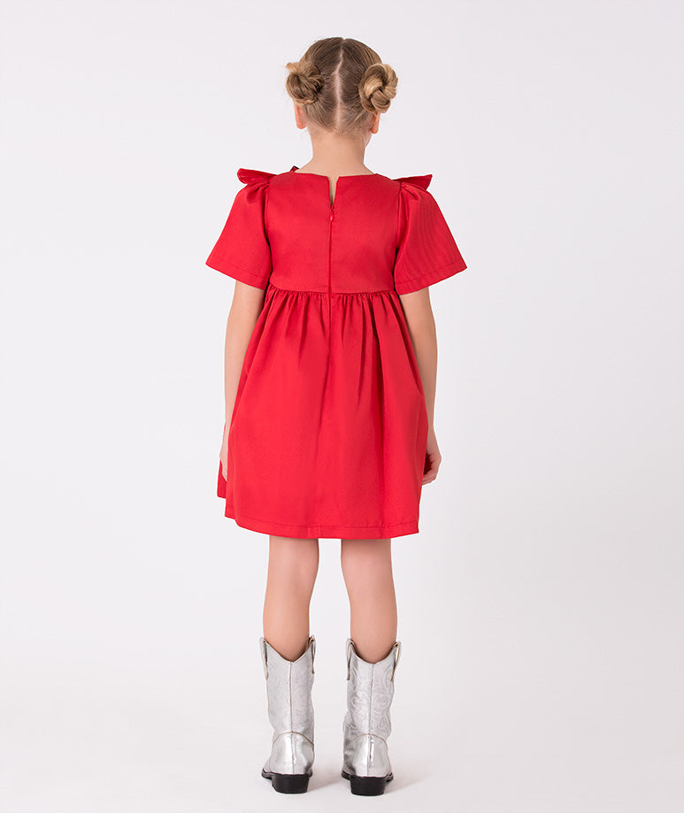 Festive red dress for girls with metallic accents – Charming dress with a large metallic bow and ruffle detailing, creating a vibrant and chic outfit