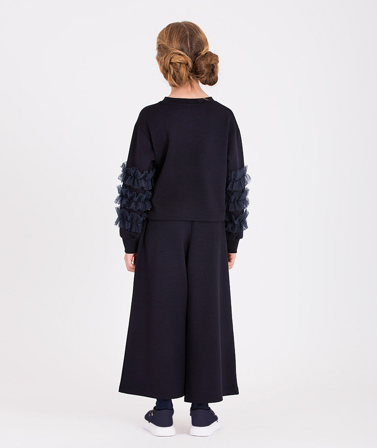 Elegant navy ensemble for girls featuring a ruffled-sleeve top and comfortable wide-leg pants