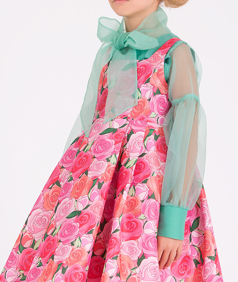 a minty green blouse paired with a stunning flower-print dress